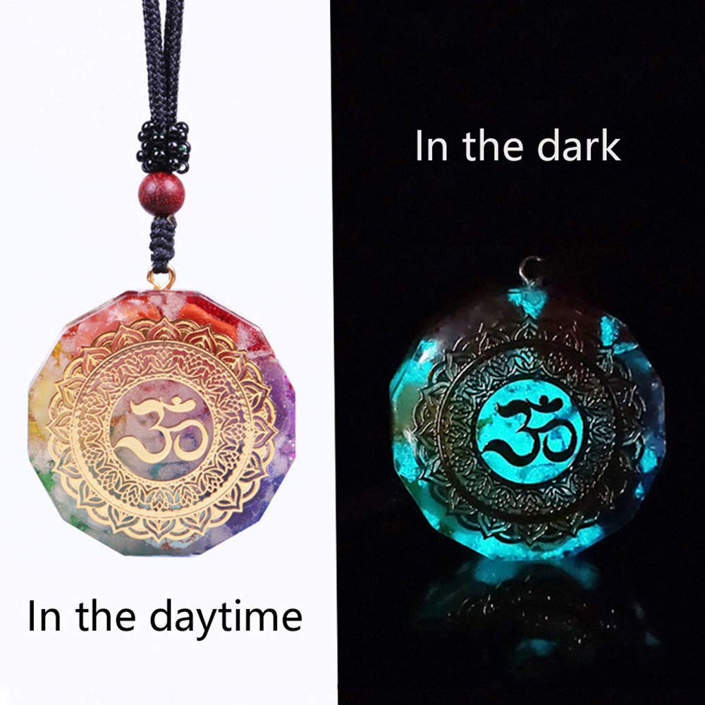 Resin-sealed Day Day Up orgonite pendant detail with copper energy symbol.