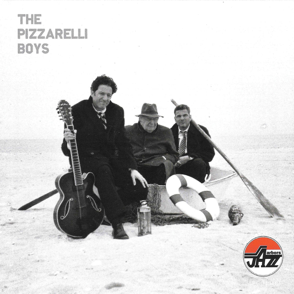 Desert Island Dreamers cover art with the Pizzarelli trio, ideal for intimate jazz listening.