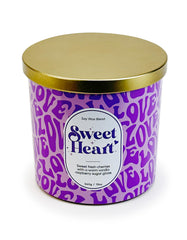 Designstyles Sweet Heart candle on a dining table creating romantic ambiance.