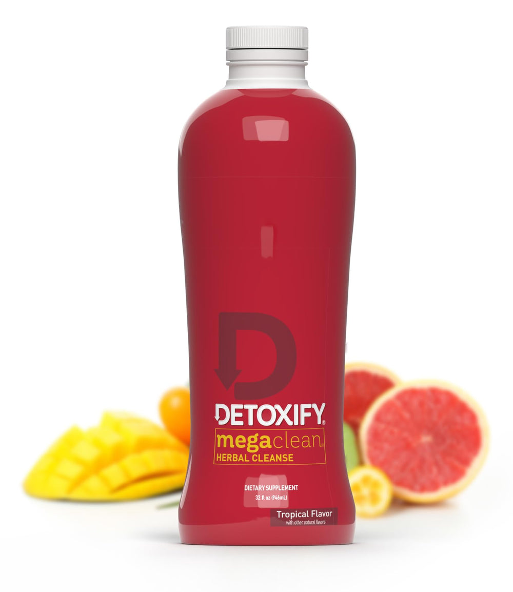 Detoxify Mega Clean Tropical bottle with pour, a refreshing detox moment.