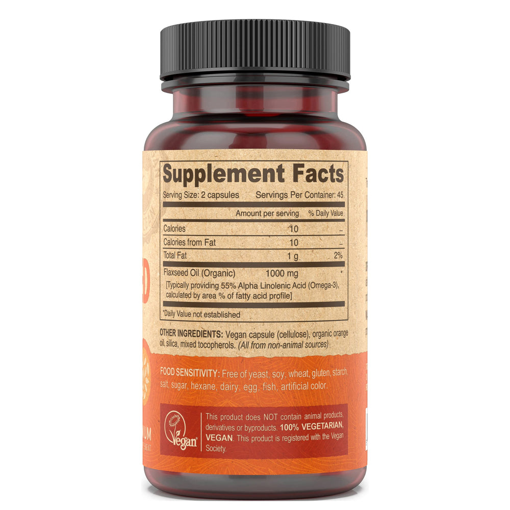 Close-up label highlights cold-pressed unrefined flax oil quality and vegan ingredients.