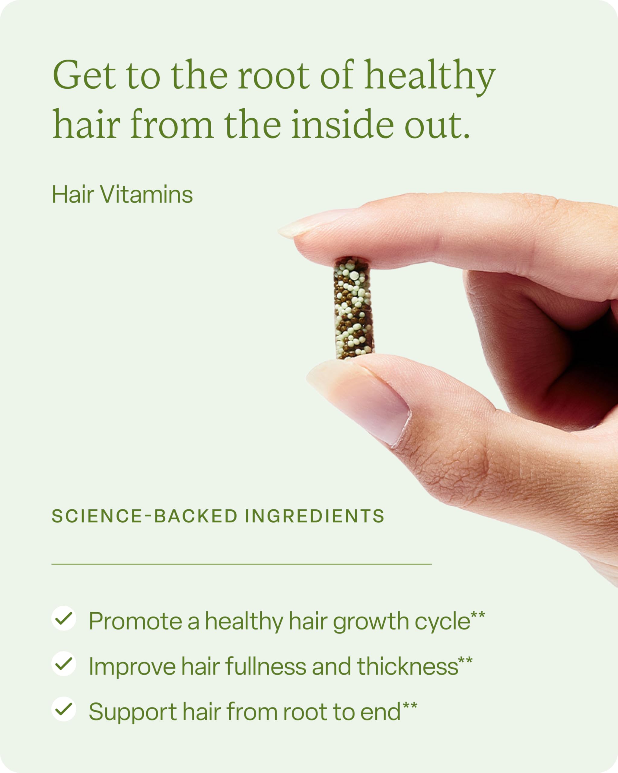 Divi Hair Vitamins capsules close-up highlighting slow-release beadlets.