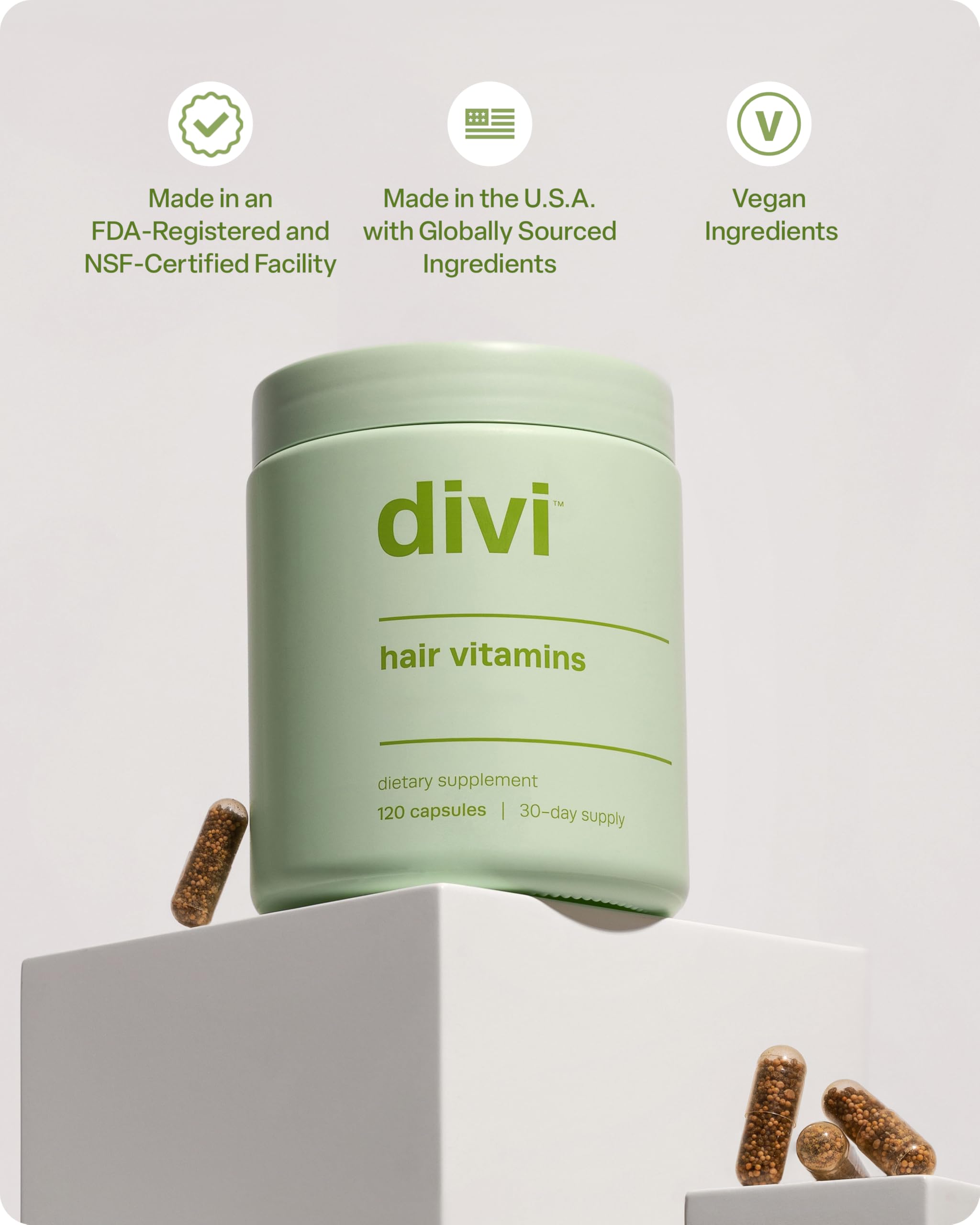 Divi Hair Vitamins capsules arranged for daily routine use.