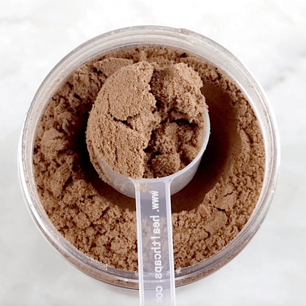 Divine Health Keto Zone MCT Powder in a glass enhances hydration-friendly energy