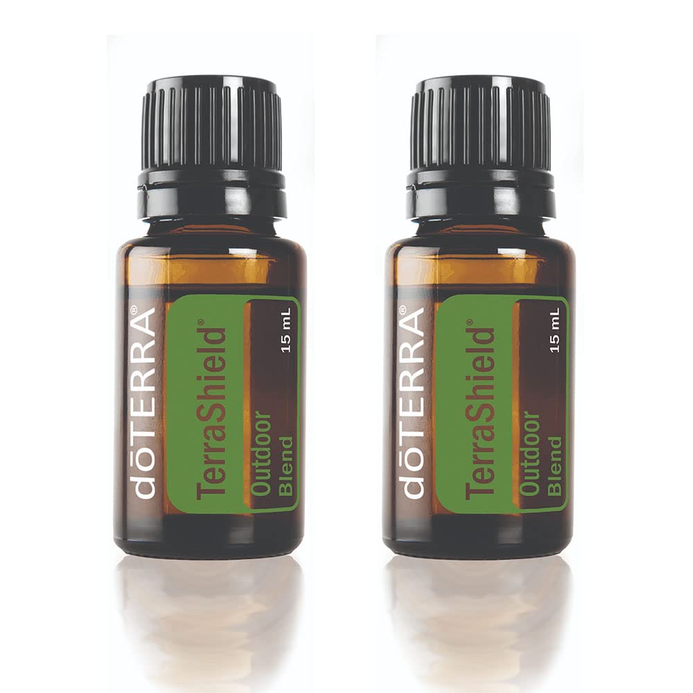 doTERRA TerraShield Outdoor Blend bottle 15ml in a sunny outdoor setting for on-the-go protection.