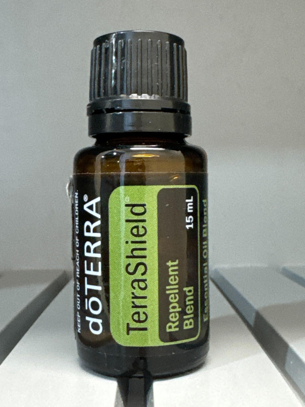 TerraShield Outdoor Blend against a field backdrop during outdoor gatherings.