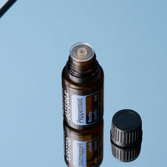 doTERRA Peppermint oil drops captured for a quick scent boost.