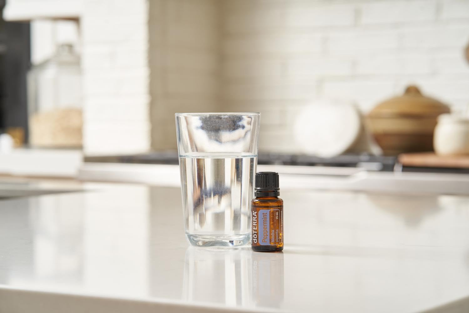 doTERRA Peppermint essential oil applied topically with dilution for cooling skincare moments.