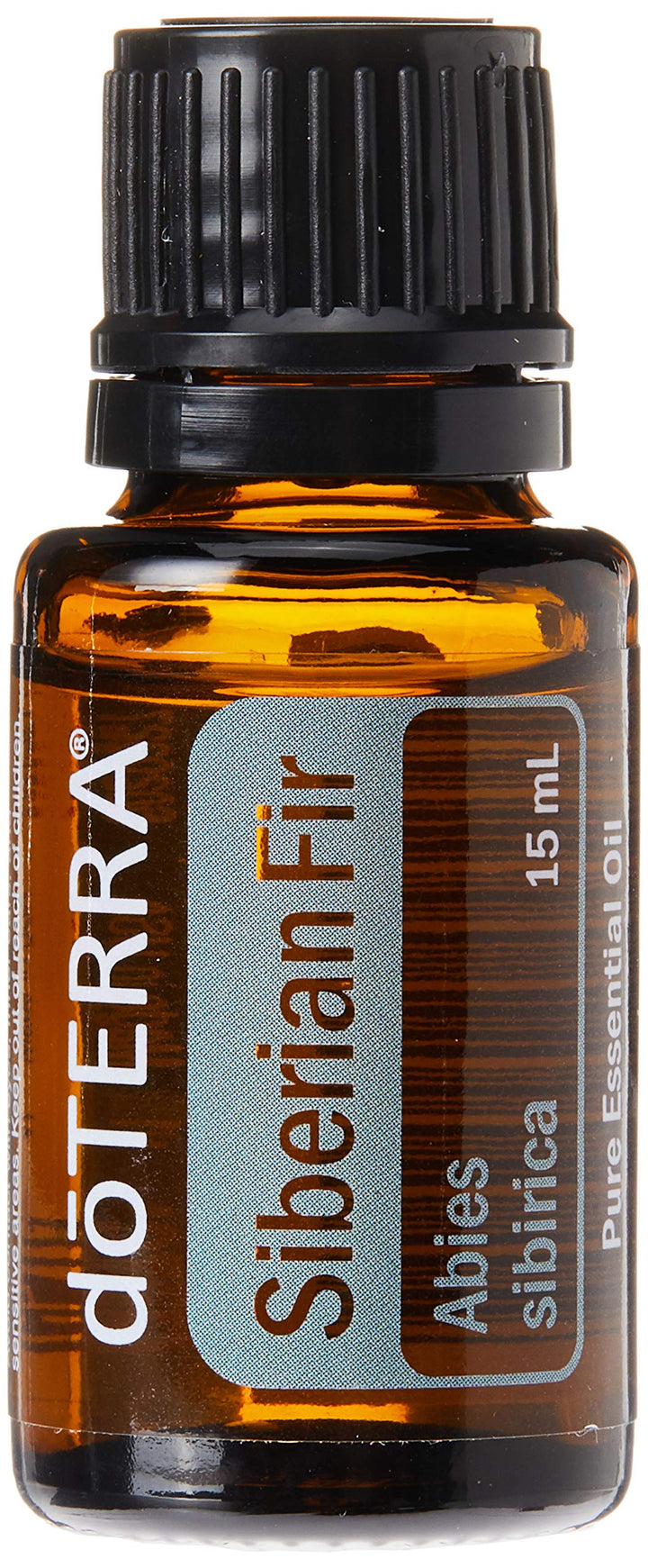 doTERRA Siberian Fir bottle pour evokes a calming, grounding scent for massage.