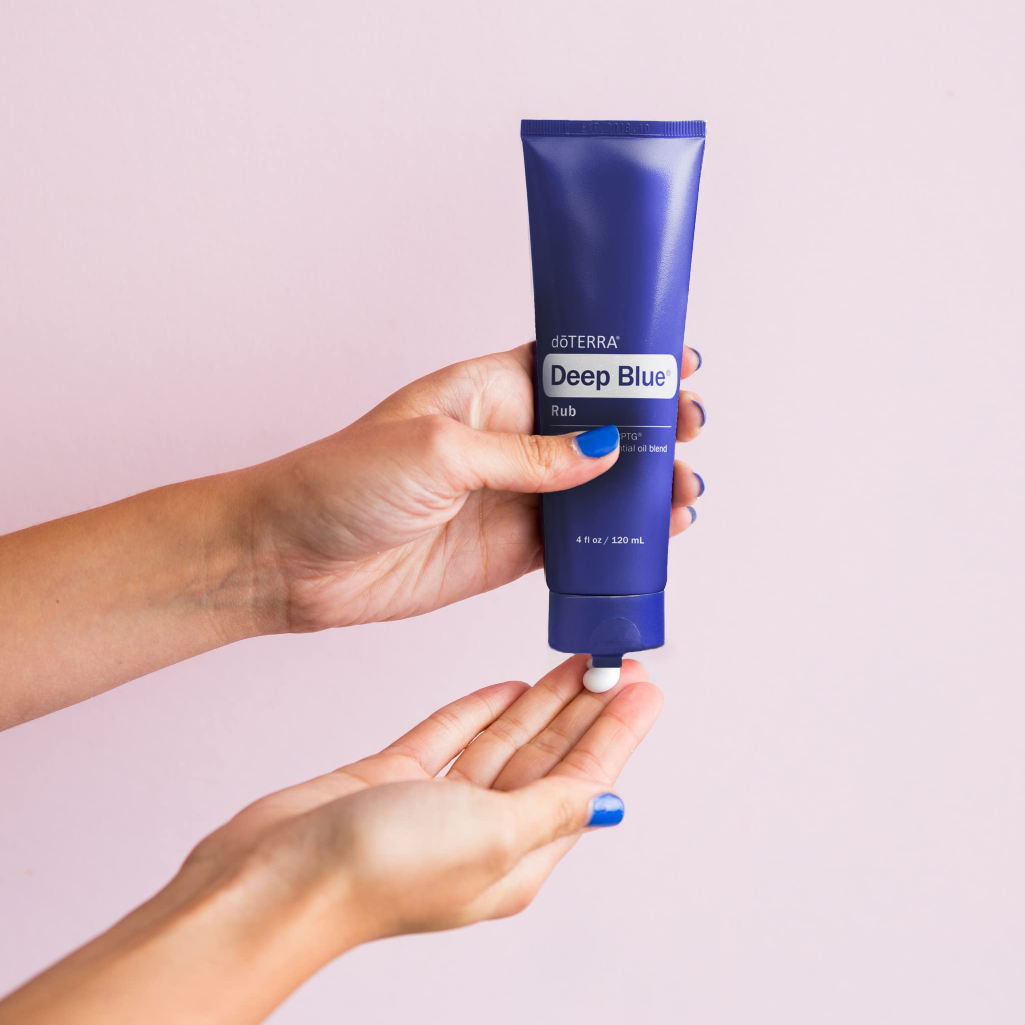 doTERRA Deep Blue Rub on a spa-like nightstand for relaxation