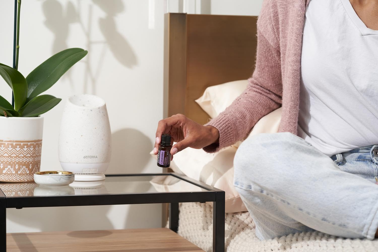 doTERRA Lavender oil close-up dropper releasing soothing essential oil
