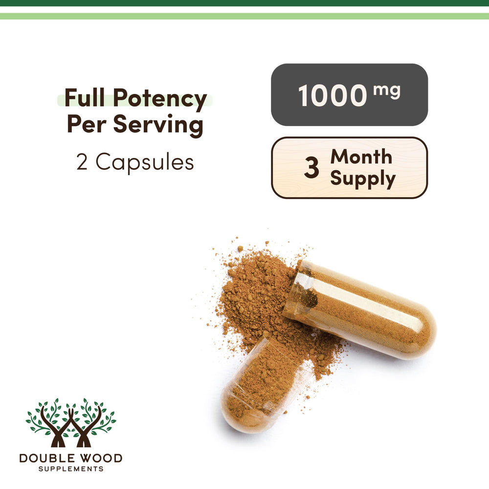 Double Wood Beef Liver Capsules bottle in hand for portable supplementation.