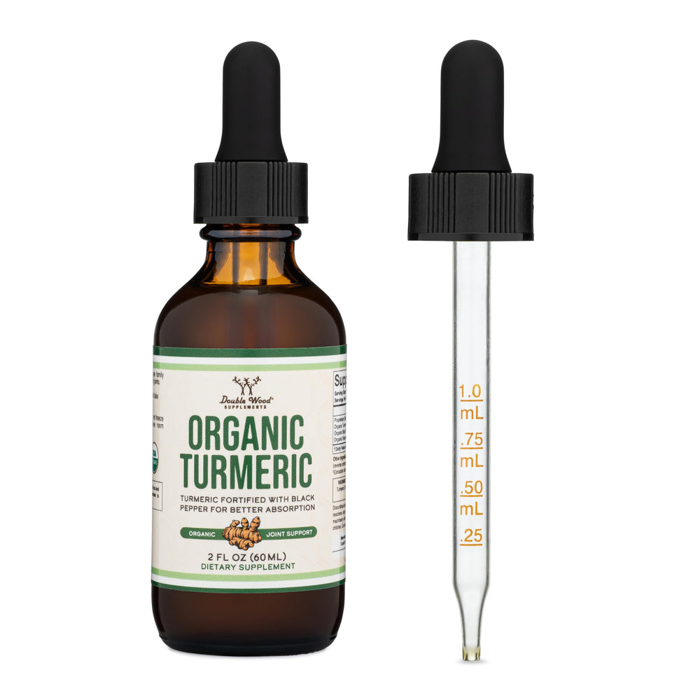 Double Wood Turmeric Drops bottle closeup emphasizes clear liquid and purity.