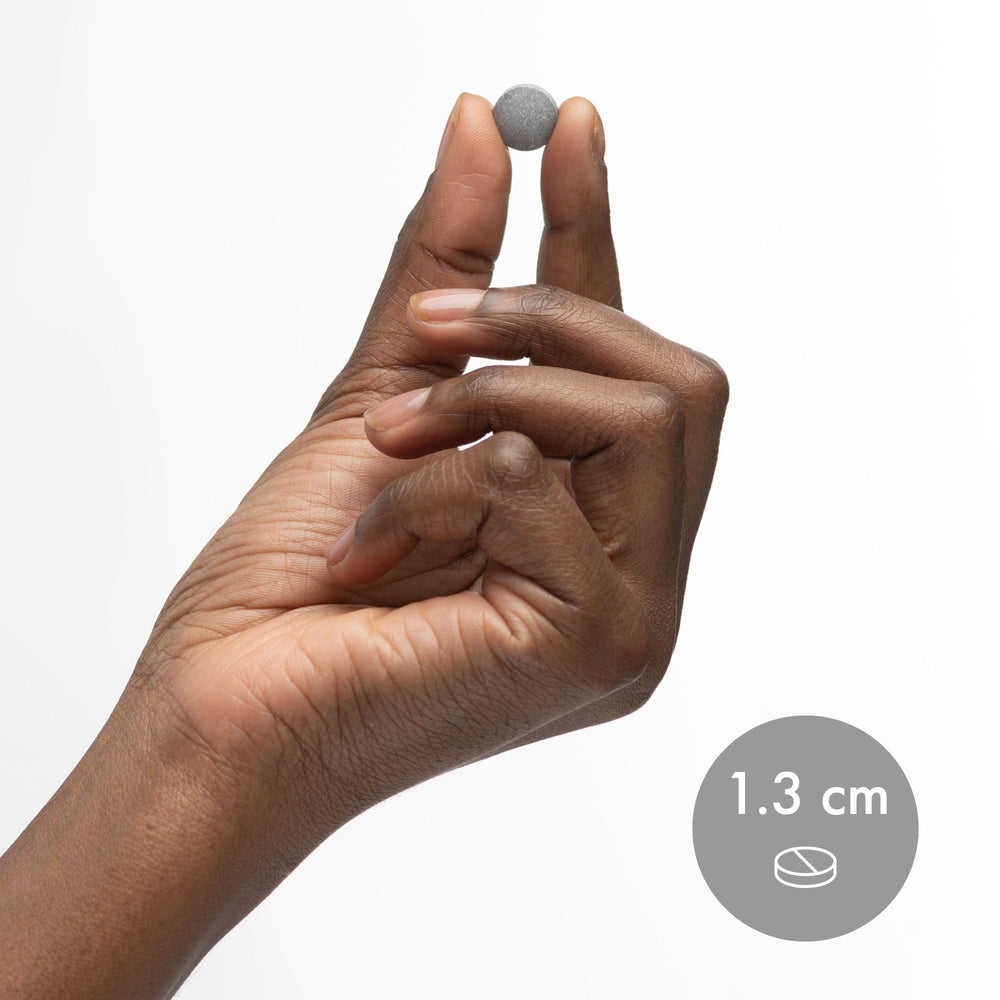 Dr. Mercola H2 glass of water with dissolving tablet for hydration.