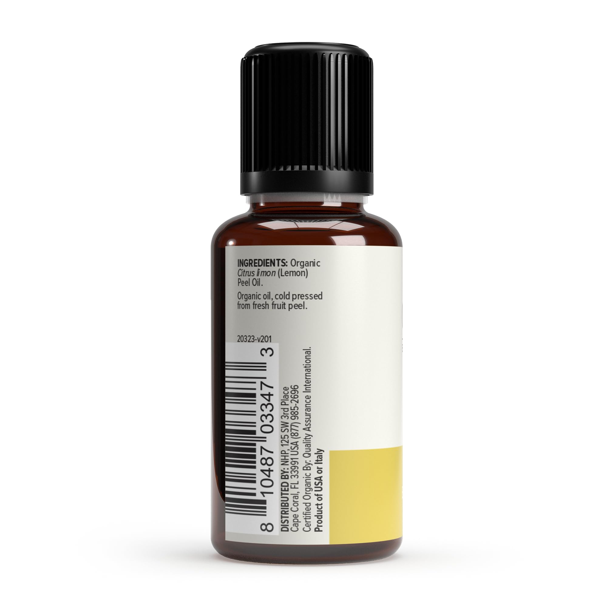 Droplet of Dr. Mercola Lemon Essential Oil ready for diffusing and massage prep.