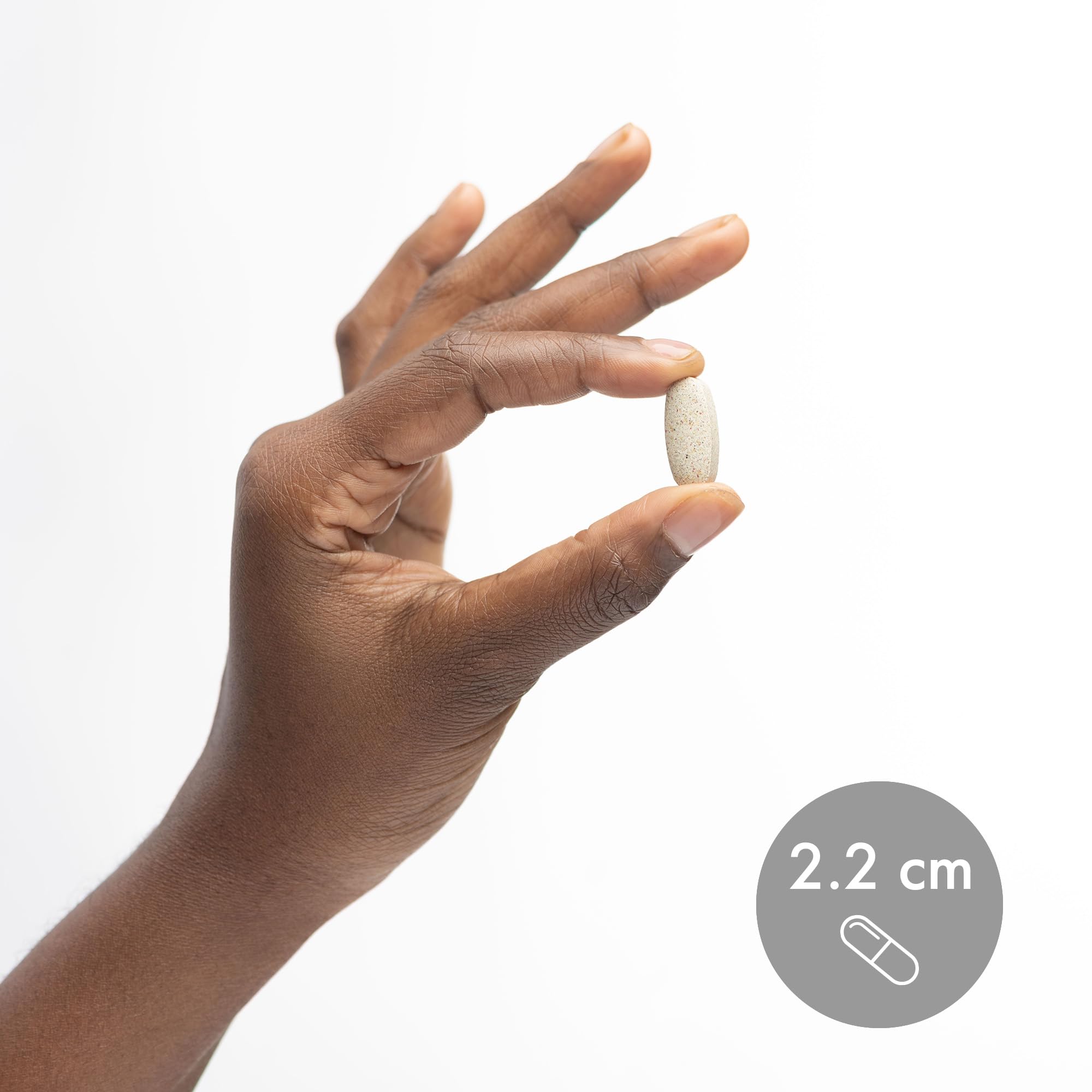 Dr. Mercola tablets arranged with glass of water for daily use.
