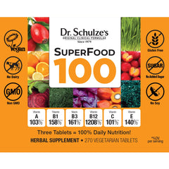 Dr. Schulze's SuperFood 100 scoop beside bottle for easy daily use