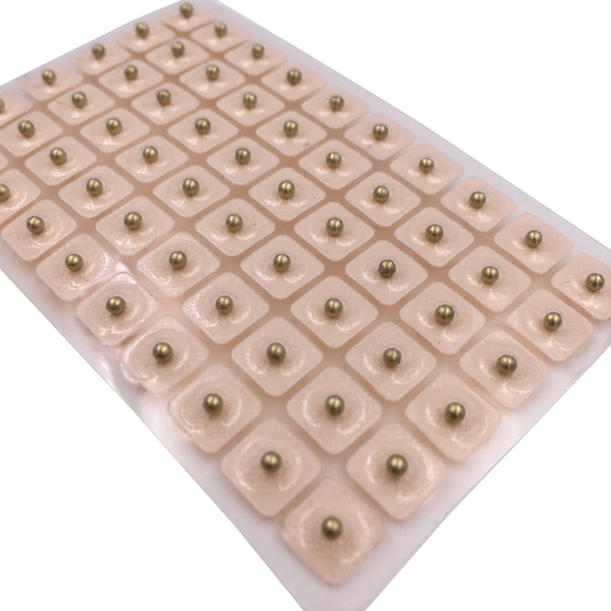Dragon Acupuncture ear beads on ear illustrate needle-free acupressure option.