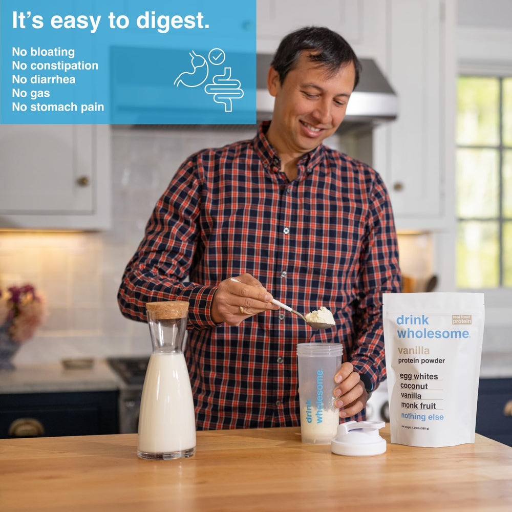 Drink Wholesome vanilla egg white protein powder scoop demonstrates easy mixing for quick, dairy-free shakes.