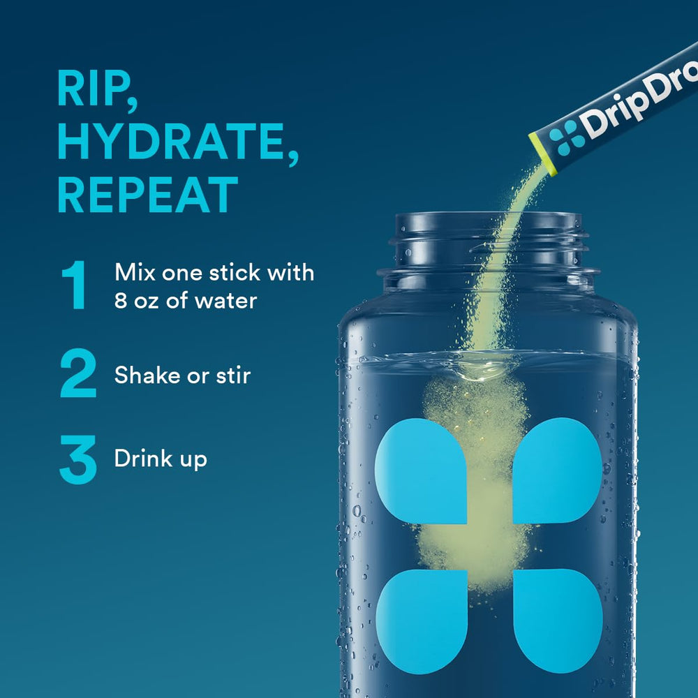 DripDrop Lemon Lime bottle with glass demonstrates convenient travel hydration on the go.