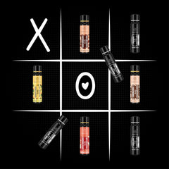 Dude's Love XOXO mango ginger oil bottle for refreshing massage and mood lift.