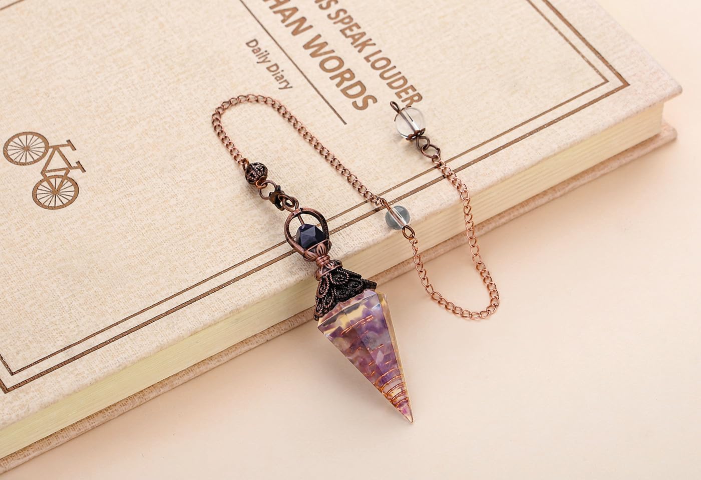 DUQGUHO amethyst pendulum enhances insight into relationships and mood.