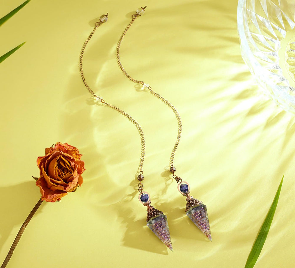 DUQGUHO copper chain pendulum highlighting crystal energy for readings.