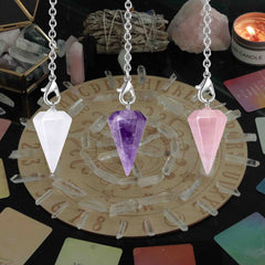 DUQGUHO crystal pendulum set showcasing three stones for versatile divination sessions