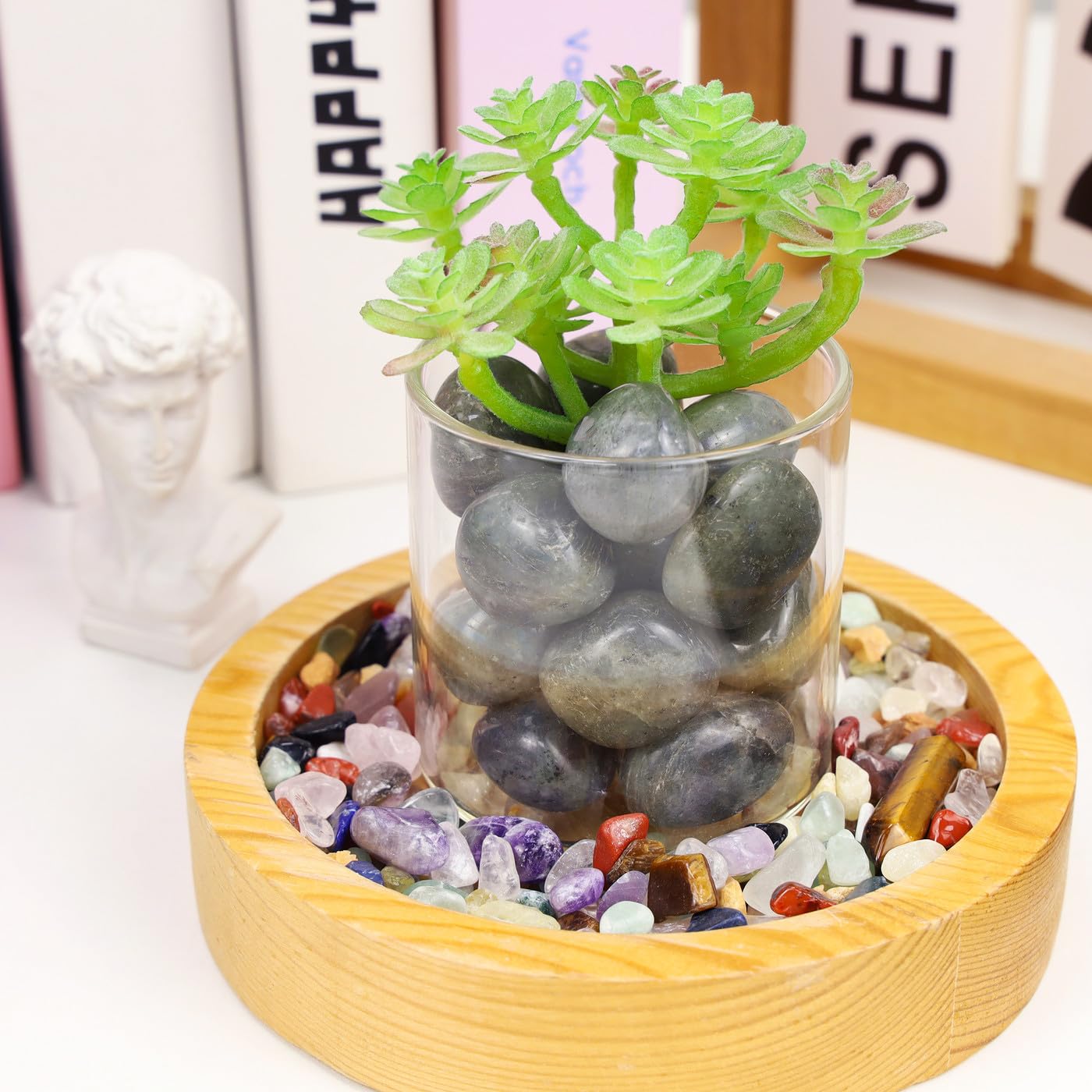 DUQGUHO Hand-holding moonstone tumbles for tactile and meditative use.