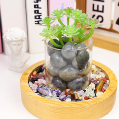 DUQGUHO Hand-holding moonstone tumbles for tactile and meditative use.