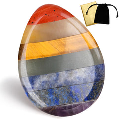 DUQGUHO 7 chakra thumb worry stone in hand for calm focus.