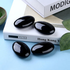 DUQGUHO Obsidian palm stone in hand for grounding during meditation
