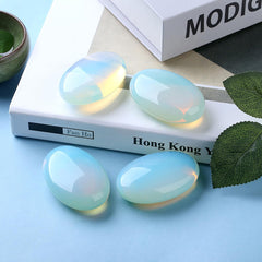 DUQGUHO opalite palm stone close-up showing color shimmer and balance.