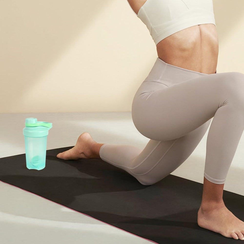 D.Y.A 16oz shaker bottle in-use with smoothie, post-workout ready.