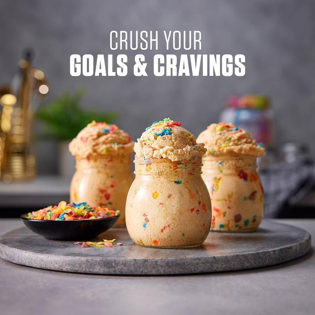 Dymatize ISO100 scoop beside a glass showing precise portion control.