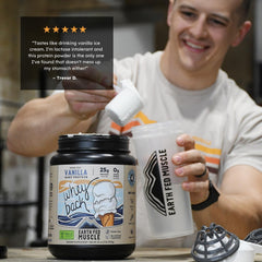 Scoop of Earth Fed Muscle Whey Back vanilla powder ready for blending