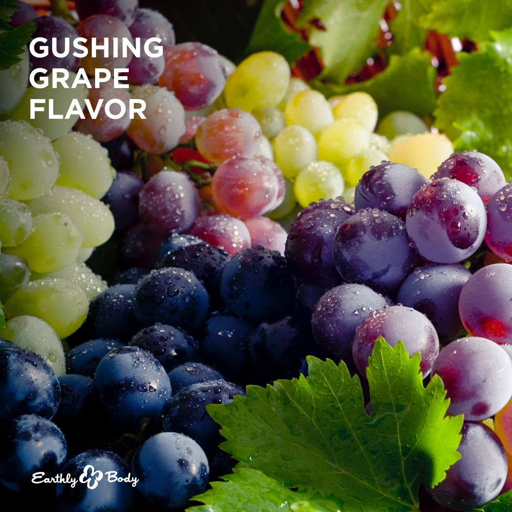 Earthly Body edible massage candle grape fragrance from natural sources in use.