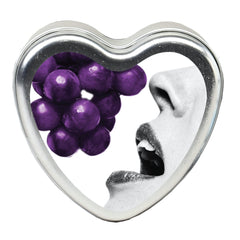 Earthly Body edible massage candle grape lit for a soothing massage oil.