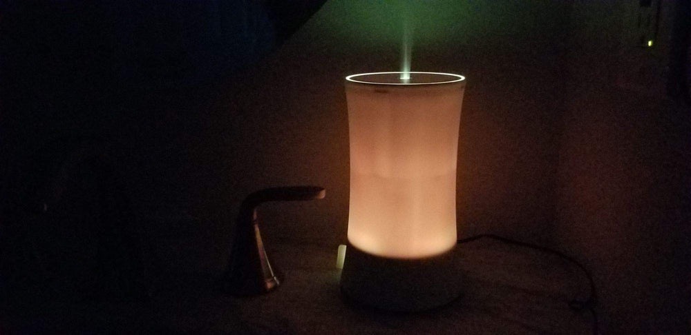 EcoGecko diffuser displaying seven LED colors for subtle room mood lighting