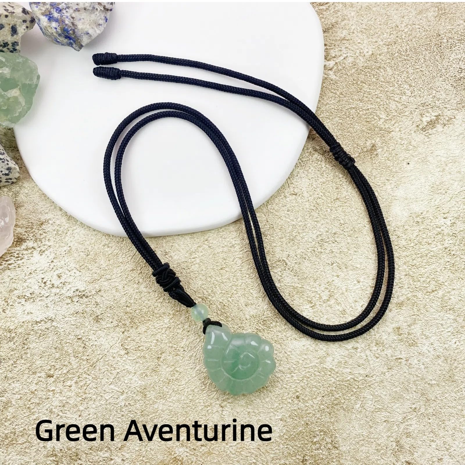 edens-call green aventurine conch pendant adds calm, ocean-inspired style to your look.