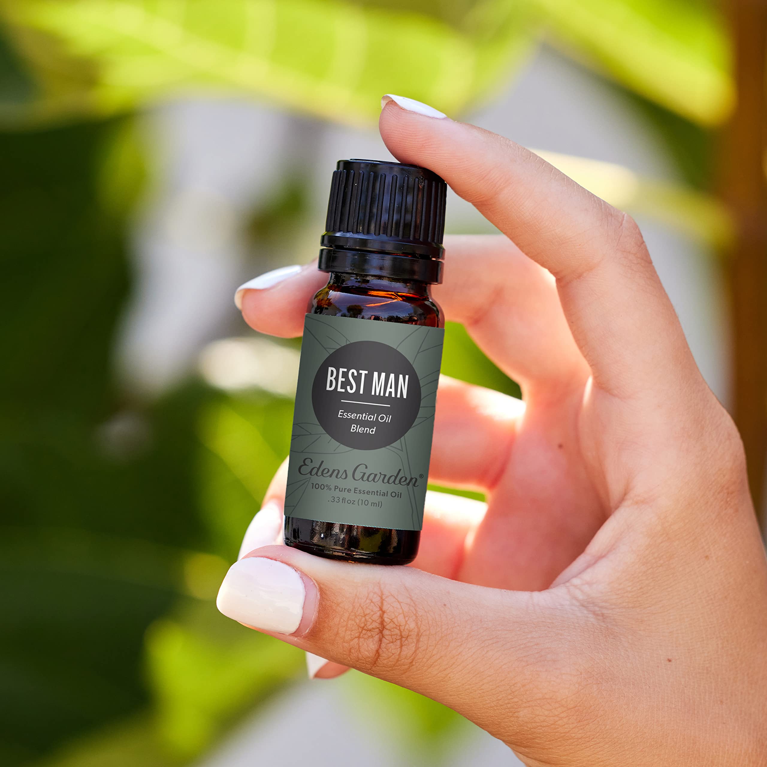 Close-up of Edens Garden Best Man bottle, premium undiluted oil ready for use.