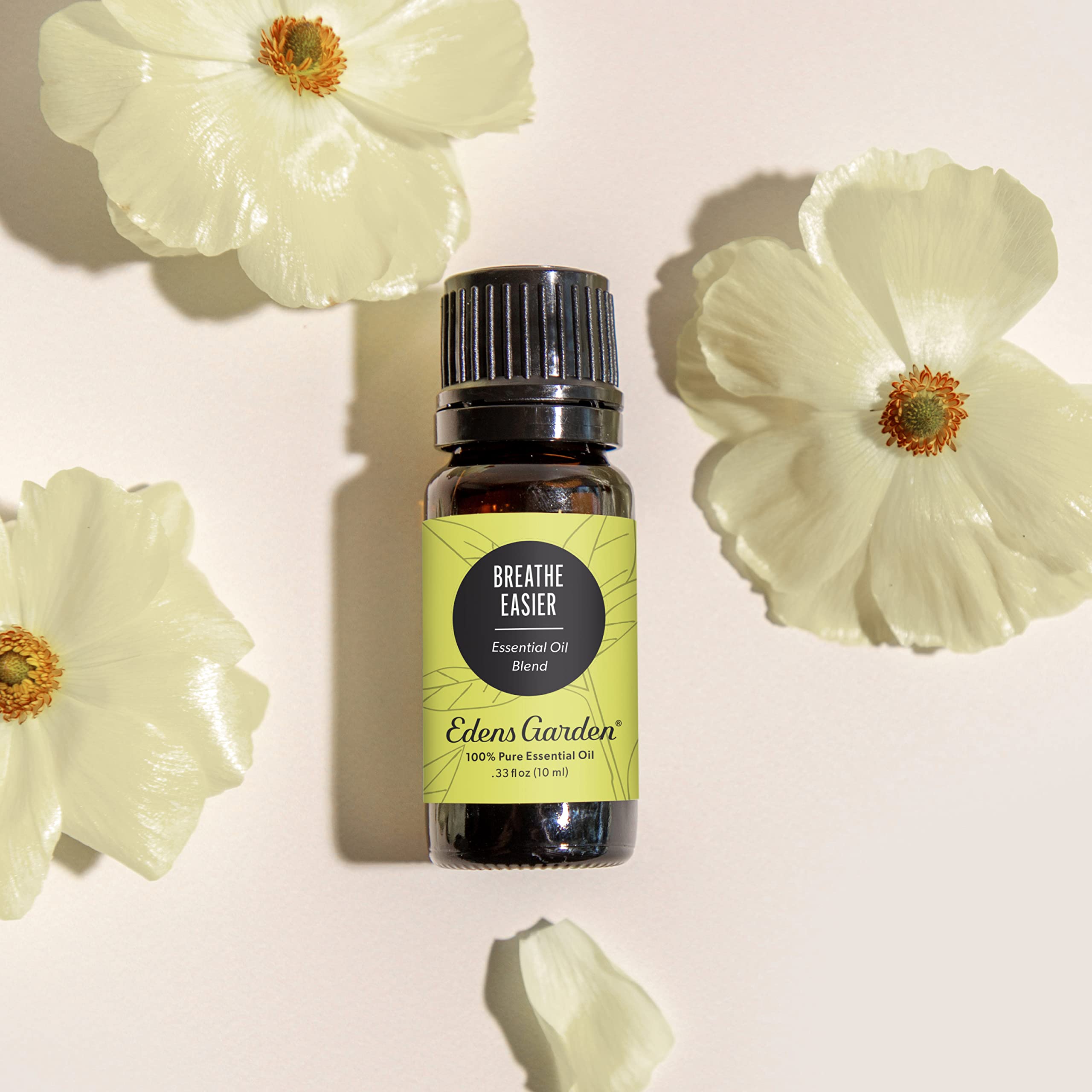 Edens Garden Breathe Easier bottle being poured for diffuser use.