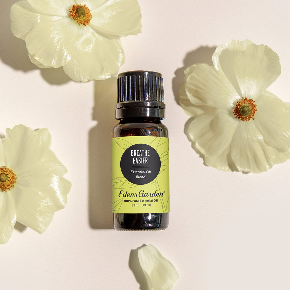 Edens Garden Breathe Easier bottle being poured for diffuser use.