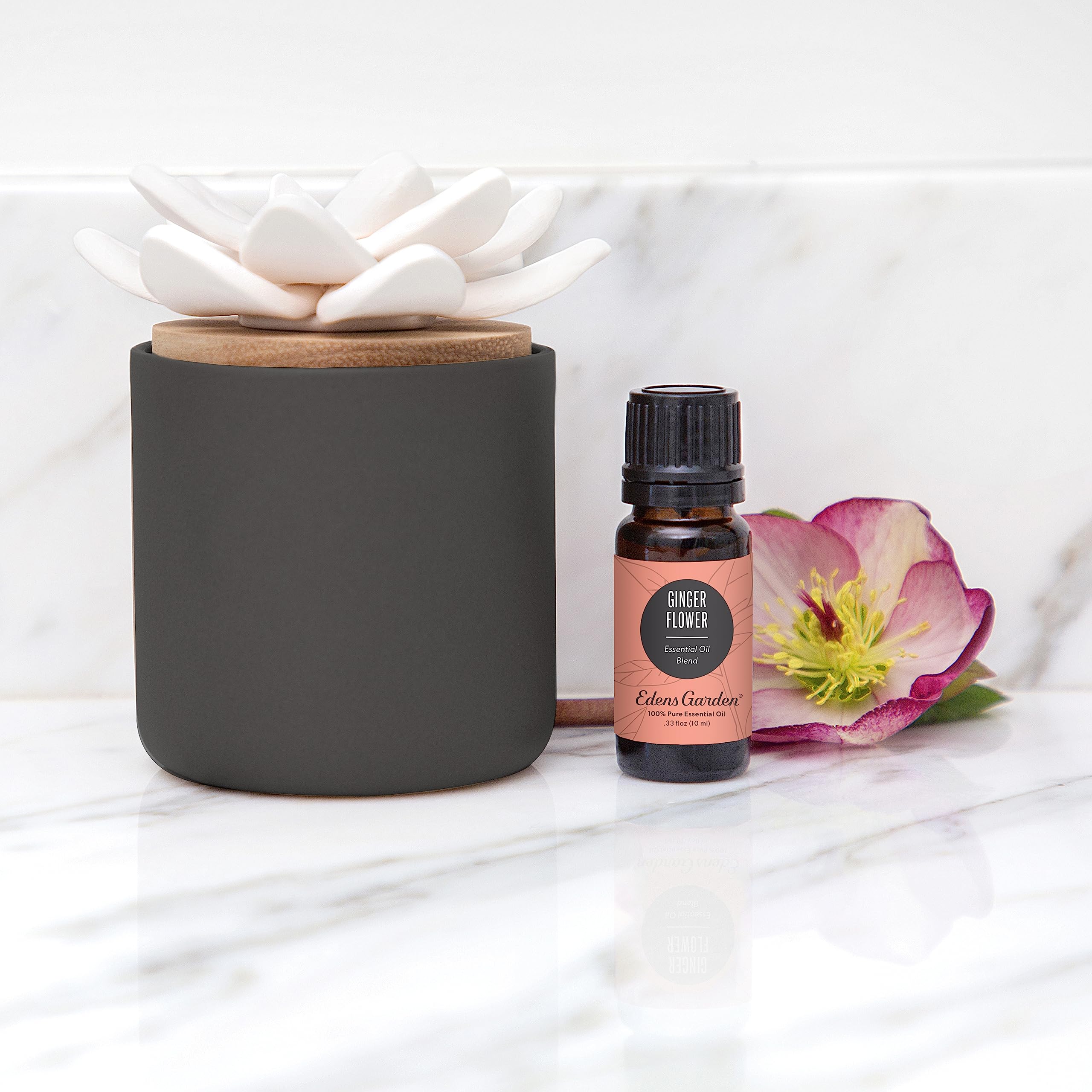 Edens Garden Charcoal Ceramic Bloom Diffuser on desk creates subtle fragrance.