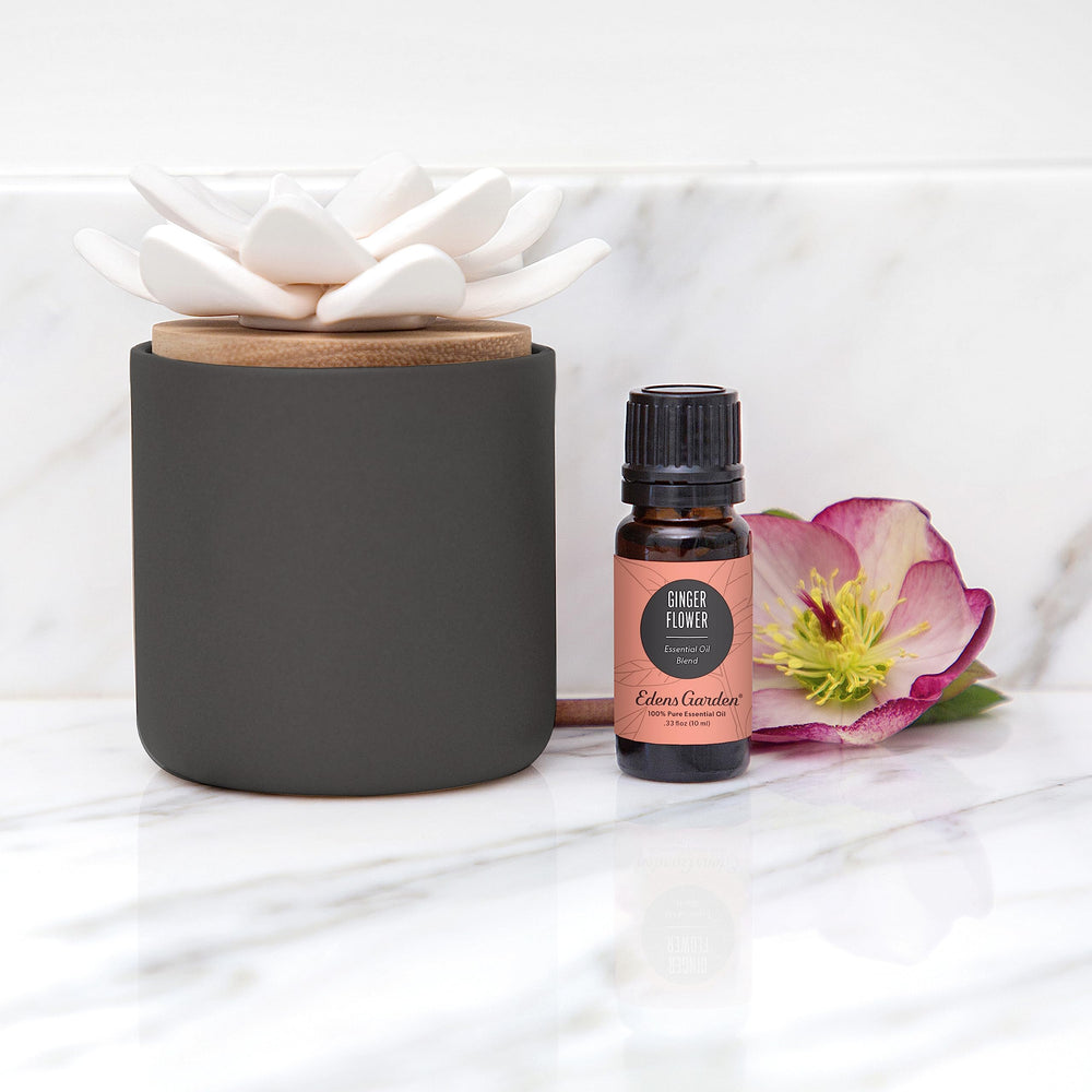 Edens Garden Charcoal Ceramic Bloom Diffuser on desk creates subtle fragrance.