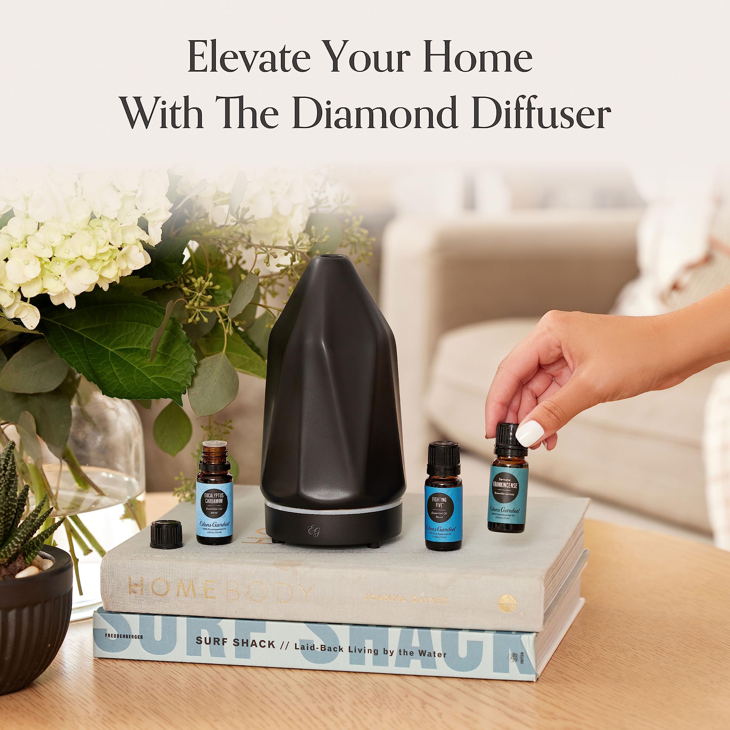 Edens Garden Charcoal Ceramic Bloom Diffuser on an office desk.