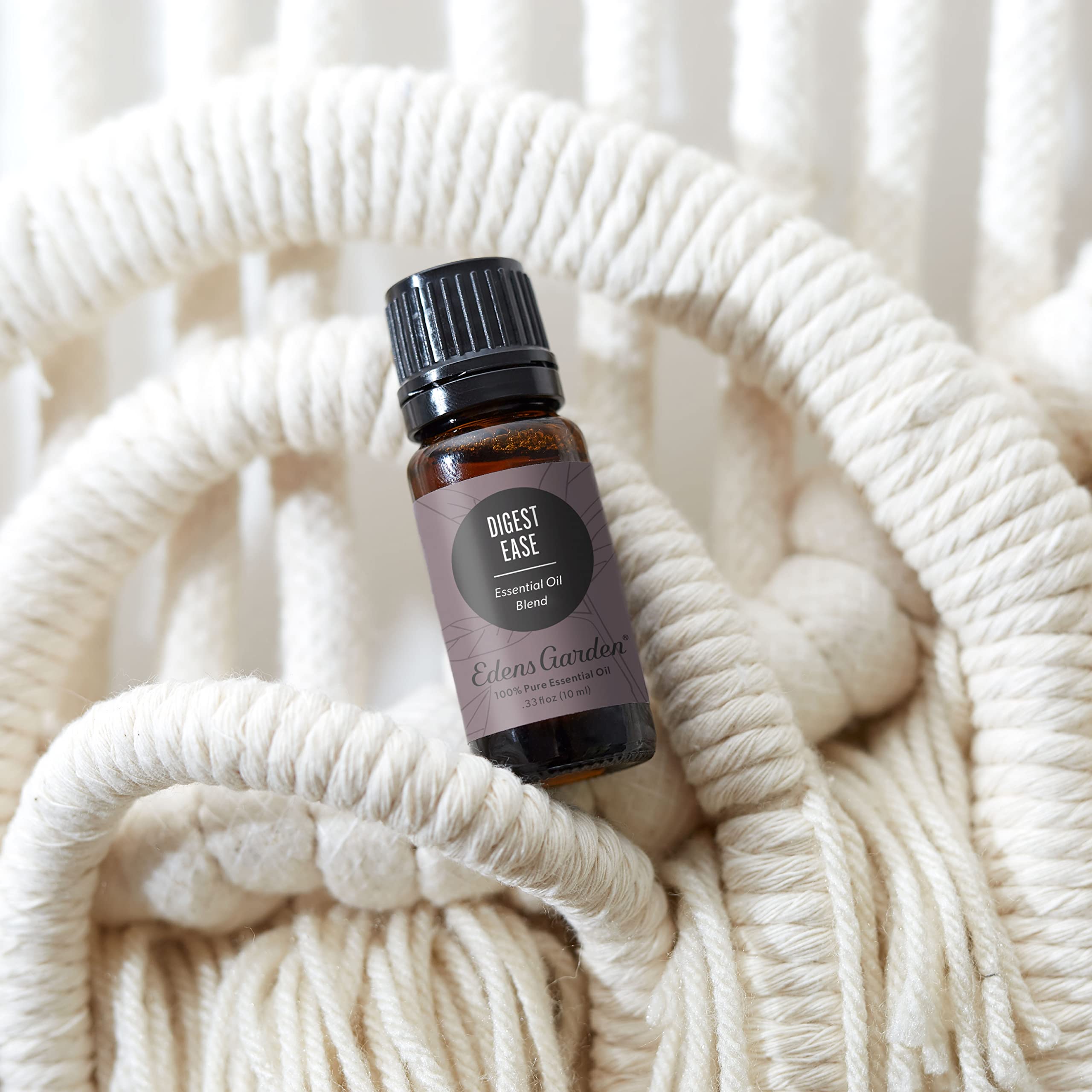 Edens Garden Digest Ease diffuser mist fills room with woodsy spice for balance.