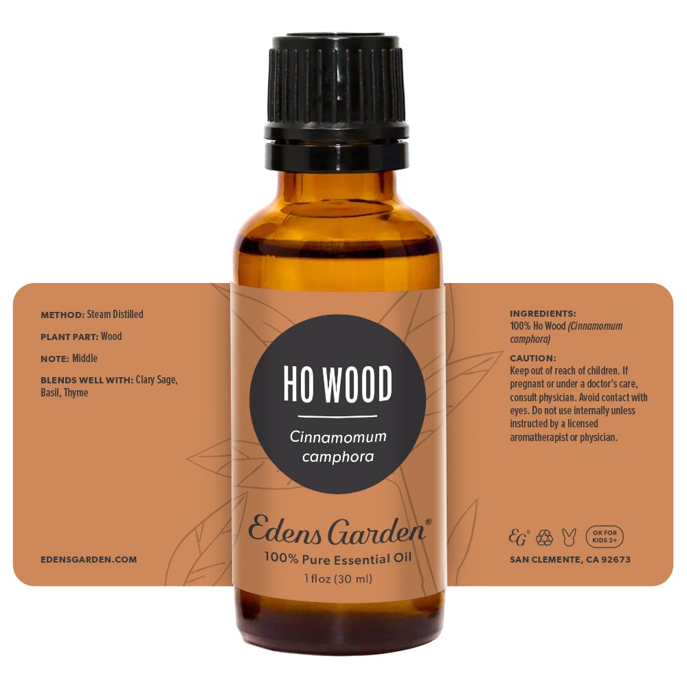 Edens Garden Ho Wood essential oil on a shelf with other oils.