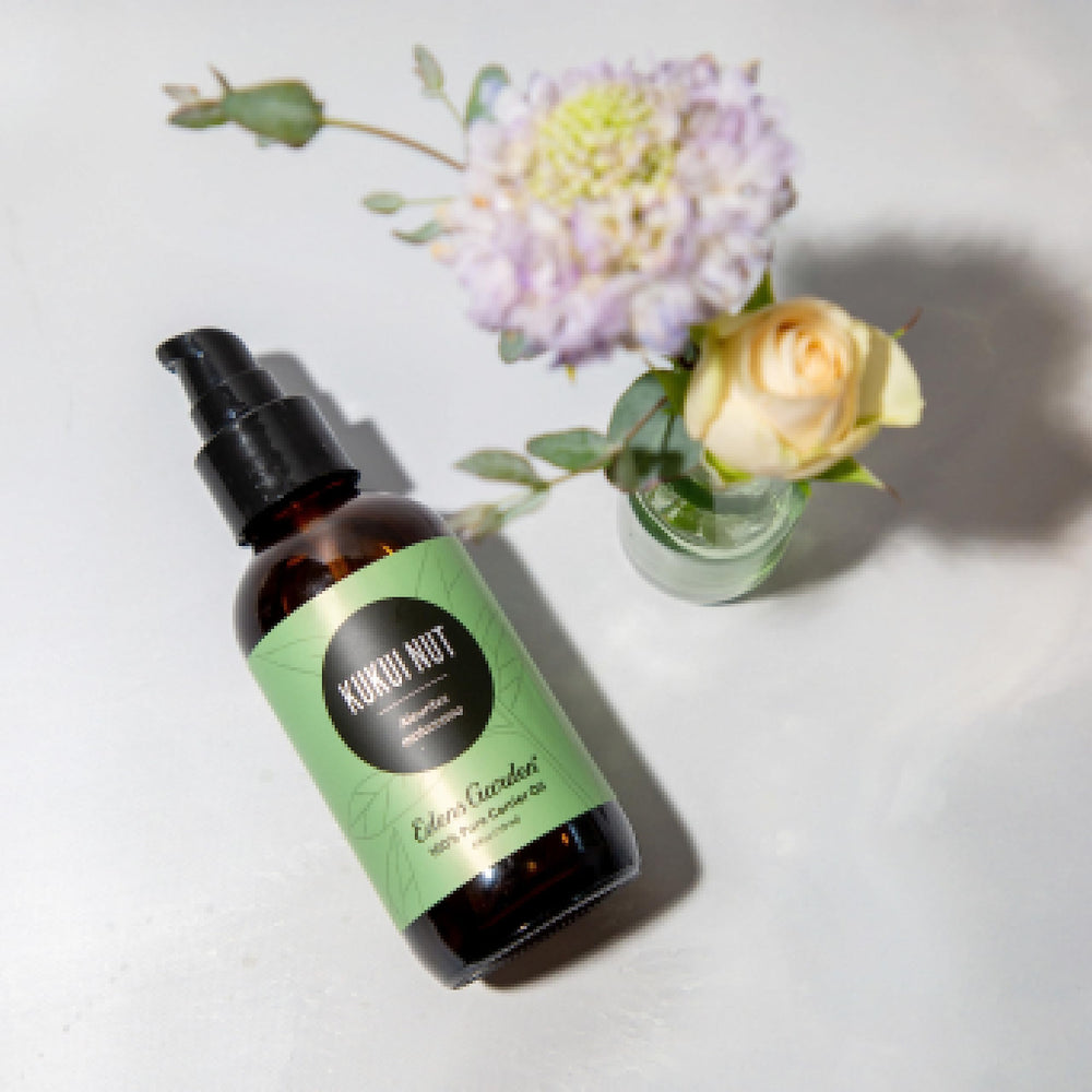 Edens Garden Kukui Nut Carrier Oil pour demonstrates easy skin application.
