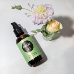 Edens Garden Kukui Nut Carrier Oil pour demonstrates easy skin application.